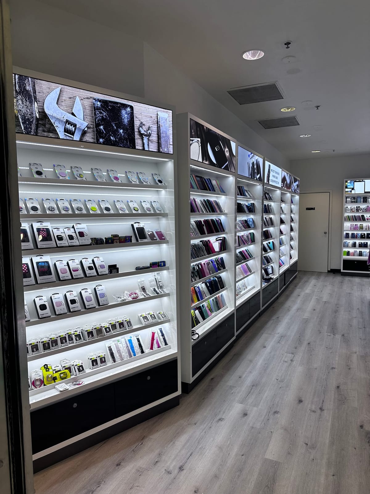 Wall of phone cases, screen protectors, and accessories at Mobile Fix Moreno Valley
